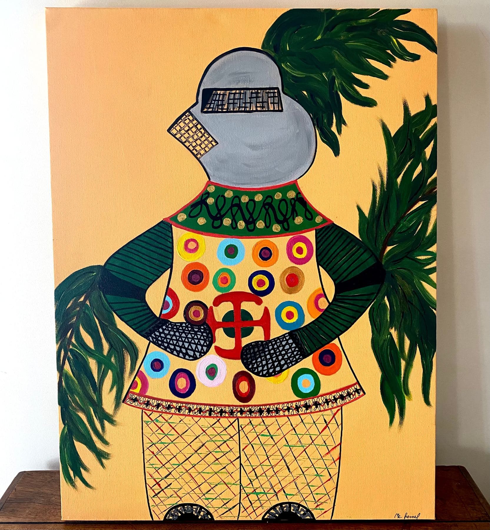 Armure d'Enfant, peinture figurative de M. C. Lamamie de Clairac représentant un heaume de chevalier recouvert de cercles concentriques colorés sur fond jaune, entouré de feuillages verts